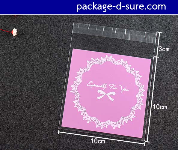 ล้างสต็อก//ถุงคุกกี้ แถบกาว 10x10 ลายโบว์ลูกใม้ พื้นหลังสีชมพูเข้ม แพ็ค 100 ใบ