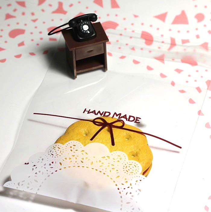 ถุงคุกกี้ แถบกาว 14x14 ถุงใส ลายโบว์ ลูกไม้ขาว แพ็ค 100 ใบ