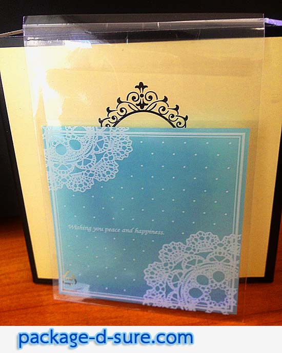 ล้างสต็อก//ถุงคุกกี้ แถบกาว 7x7 ลายโบว์ลูกใม้ขาว พื้นหลังสีฟ้าอ่อน แพ็ค 100 ใบ