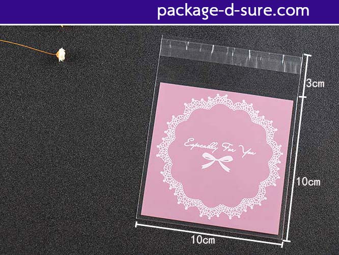 ล้างสต็อก//ถุงคุกกี้ แถบกาว 10x10 ลายโบว์ลูกใม้ พื้นหลังสีชมพูอ่อน แพ็ค 100 ใบ