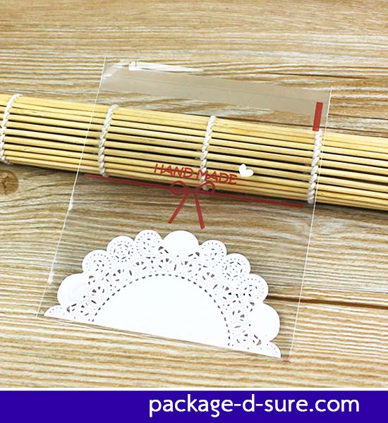 ถุงคุกกี้ แถบกาว 14x14 ถุงใส ลายโบว์ ลูกไม้ขาว แพ็ค 100 ใบ