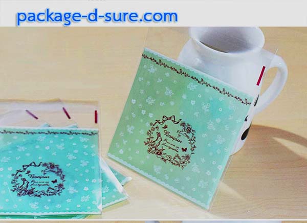ล้างสต็อก//ถุงคุกกี้ แถบกาว 7x7 ลาย bonjour ลูกไม้ใส หลังเขียวอมฟ้า แพ็ค 100 ใบ