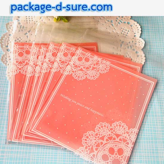 ล้างสต็อก//ถุงคุกกี้ แถบกาว 7x7 ลายโบว์ลูกใม้ขาว พื้นหลังสีชมพูอ่อน แพ็ค 100 ใบ