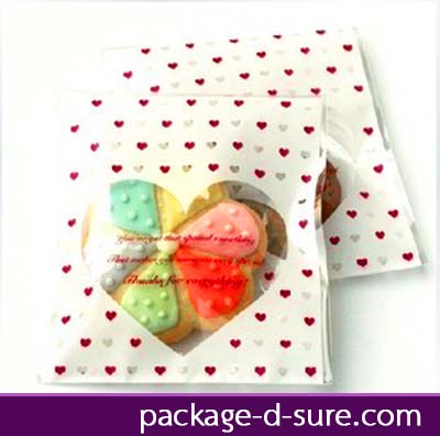 ถุงคุกกี้แถบกาว 10x10 เจาะหัวใจใส สีขาวจุดหัวใจ แพ็ค 100 ใบ