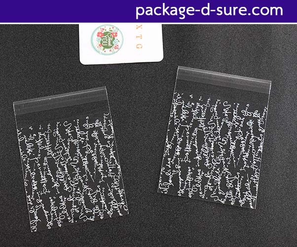 ล้างสต็อก//ถุงคุกกี้ แถบกาว 10x11 ลายตัวอักษรขาว พื้นใส แพ็ค 100 ใบ