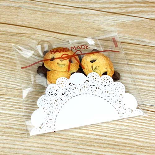 ถุงคุกกี้ แถบกาว 14x14 ถุงใส ลายโบว์ ลูกไม้ขาว แพ็ค 100 ใบ