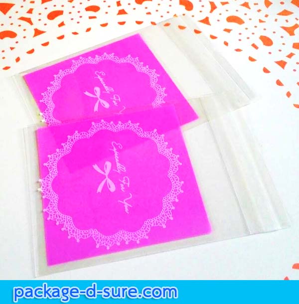 ล้างสต็อก//ถุงคุกกี้ แถบกาว 7x7 ลายโบว์ลูกใม้ขาว พื้นหลังสีชมพูบานเย็น แพ็ค 100 ใบ