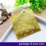 ล้างสต็อก//ถุงคุกกี้ แถบกาว 10x10 ลายโบว์ขาวเล็กๆ พื้นทอง แพ็ค 100 ใบ