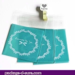 ล้างสต็อก//ถุงคุกกี้ แถบกาว 7x7 ลายโบว์ลูกใม้ พื้นหลังสีฟ้า แพ็ค 100 ใบ